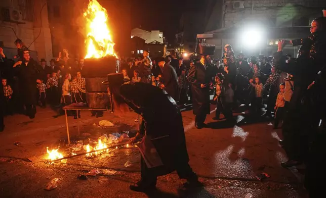 Ultra-Orthodox Jews dance around a bonfire during Lag BaOmer celebrations in Jerusalem, Thursday, May 15, 2025. (AP Photo/Ohad Zwigenberg)