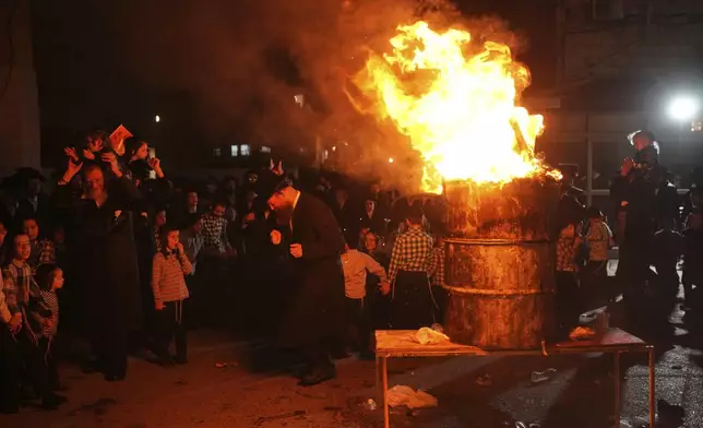Ultra-Orthodox Jews dance around a bonfire during Lag BaOmer celebrations in Jerusalem, Thursday, May 15, 2025. (AP Photo/Ohad Zwigenberg)