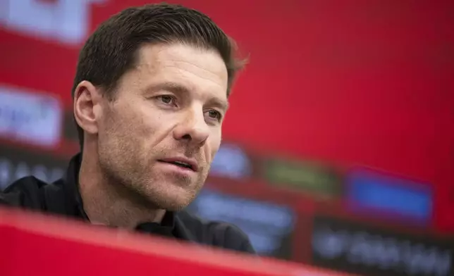 Leverkusen's coach Xabi Alonso attends a press conference in Leverkusen, Germany, Friday, May 9, 2025. (Marius Becker/dpa via AP)