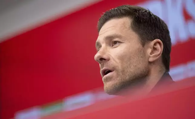 Leverkusen's coach Xabi Alonso attends a press conference in Leverkusen, Germany, Friday, May 9, 2025. (Marius Becker/dpa via AP)