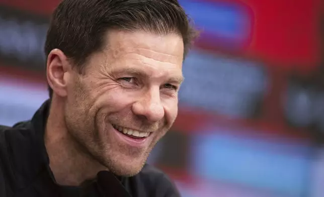 Leverkusen's coach Xabi Alonso attends a press conference in Leverkusen, Germany, Friday, May 9, 2025. (Marius Becker/dpa via AP)