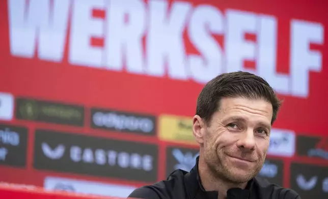 Leverkusen's coach Xabi Alonso attends a press conference in Leverkusen, Germany, Friday, May 9, 2025. (Marius Becker/dpa via AP)