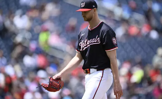 Washington Nationals starting pitcher Michael Soroka walks back to the dugout after he was pulled during the sixth inning of a baseball game against the Cleveland Guardians, Wednesday, May 7, 2025, in Washington. (AP Photo/Nick Wass)