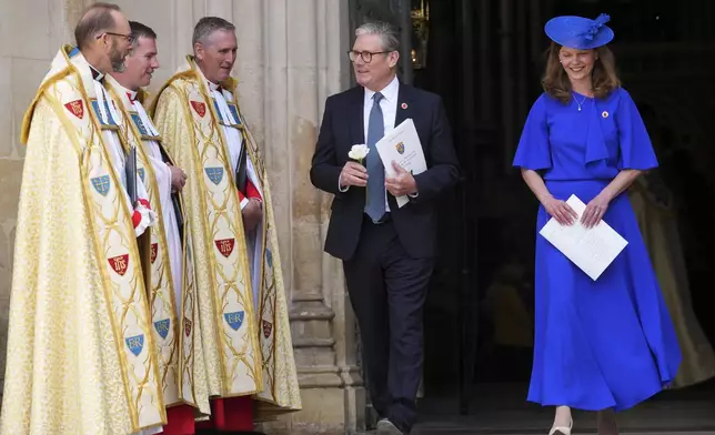 Britain's Prime Minister Keir Starmer and wife Victoria leave after attending a Service of Thanksgiving at Westminster Abbey on V-E Day in London, Thursday, May 8, 2025.(AP Photo/Kirsty Wigglesworth)