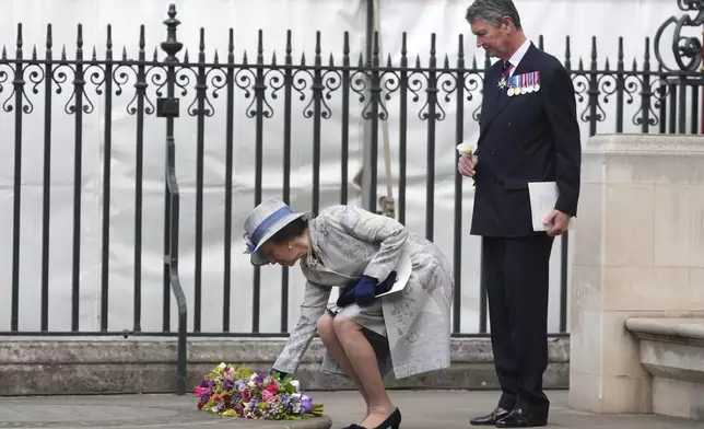 Britain's Princess Anne lays down flowers after attending a Service of Thanksgiving at Westminster Abbey on V-E Day in London, Thursday, May 8, 2025.(AP Photo/Kirsty Wigglesworth)