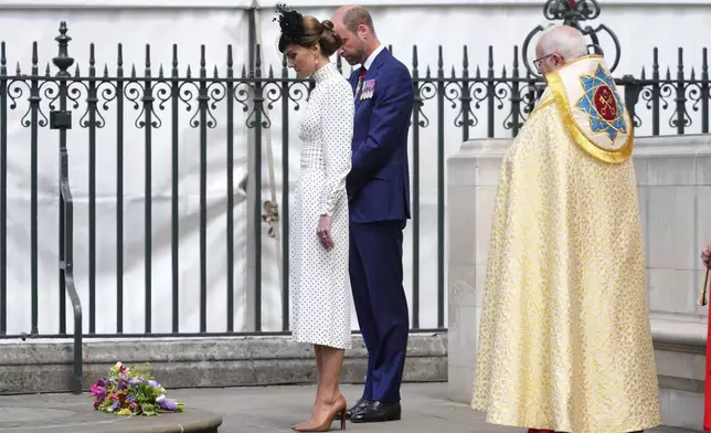 Britain's Kate, Princess of Wales, and Prince William stand in silence after attending a Service of Thanksgiving at Westminster Abbey on V-E Day in London, Thursday, May 8, 2025.(AP Photo/Kirsty Wigglesworth)