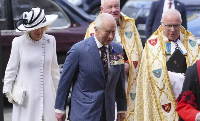 Britain's King Charles III and Queen Camilla arrive to attend a Service of Thanksgiving at Westminster Abbey on V-E Day in London, Thursday, May 8, 2025.(AP Photo/Kirsty Wigglesworth)