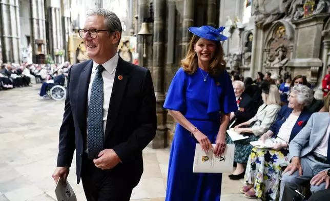Britain's Prime Minister Sir Keir Starmer and his wife Lady Victoria Starmer attend a Service of Thanksgiving at Westminster Abbey on V-E Day in London, Thursday, May 8, 2025. (Jordan Pettitt/Pool Photo via AP)