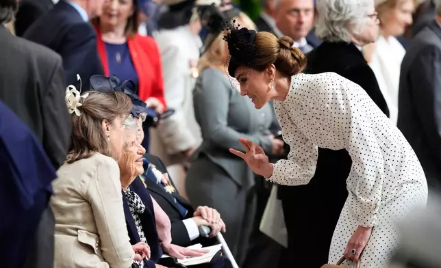 Kate, Princess of Wales, speaks to a veteran during a Service of Thanksgiving at Westminster Abbey on V-E Day in London, Thursday, May 8, 2025. (Jordan Pettitt/Pool Photo via AP)