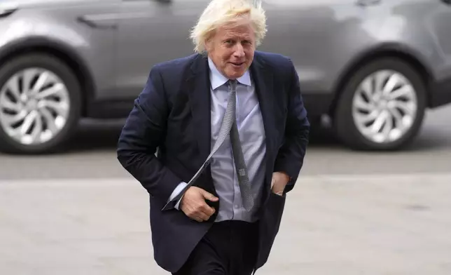 Former Britain's Prime Minister Boris Johnson arrives to attend a Service of Thanksgiving at Westminster Abbey on V-E Day in London, Thursday, May 8, 2025.(AP Photo/Kirsty Wigglesworth)
