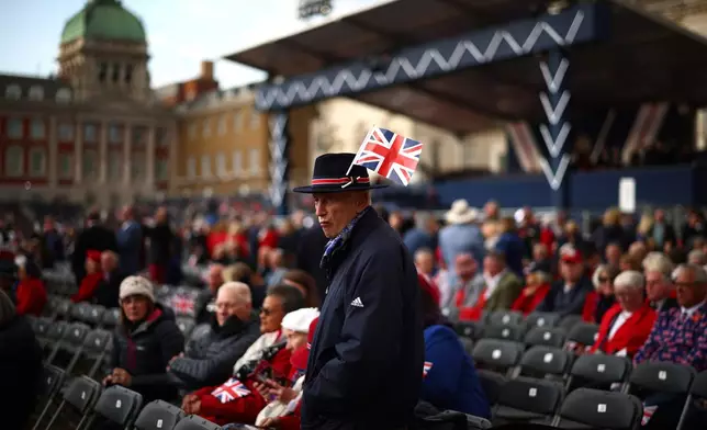 Guests arrive for a concert to mark the 80th Anniversary of V-E Day at Horse Guards Parade, London, Thursday May 8, 2025. (Henry Nicholls/Pool via AP)
