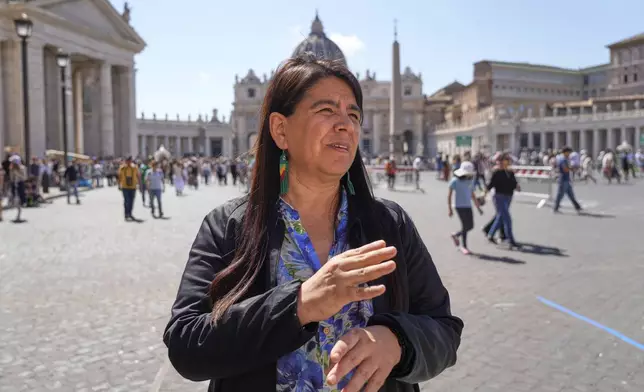Peruvian investigative journalist Paola Margot Ugaz Cruz talks with the Associated Press near St. Peter's Square at the Vatican, Monday, May 19, 2025. (AP Photo/Gregorio Borgia)
