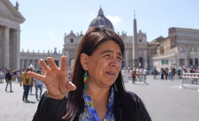Peruvian investigative journalist Paola Margot Ugaz Cruz talks with the Associated Press near St. Peter's Square at the Vatican, Monday, May 19, 2025. (AP Photo/Gregorio Borgia)