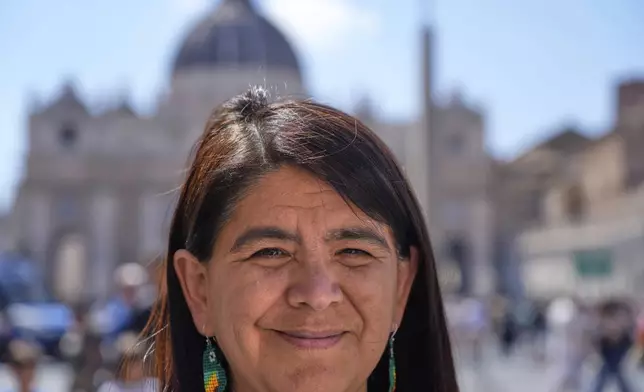 Peruvian investigative journalist Paola Margot Ugaz Cruz talks with the Associated Press near St. Peter's Square at the Vatican, Monday, May 19, 2025. (AP Photo/Gregorio Borgia)