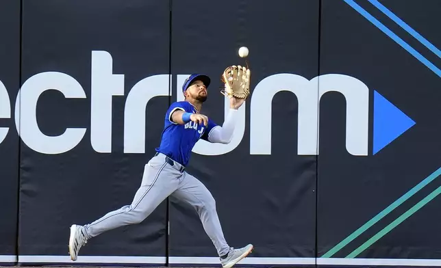 Toronto Blue Jays outfielder Jonatan Clase makes the catch on a fly out by Tampa Bay Rays' Curtis Mead during the second inning of a baseball game Friday, May 23, 2025, in Tampa, Fla. (AP Photo/Chris O'Meara)