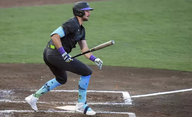 Tampa Bay Rays' Josh Lowe watches his double off Toronto Blue Jays pitcher Eric Lauer during the second inning of a baseball game Friday, May 23, 2025, in Tampa, Fla. (AP Photo/Chris O'Meara)
