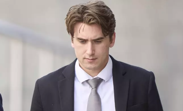 Michael McLeod, one of five members of Canada’s 2018 world junior hockey team charged with sexual assault last year for an incident that allegedly took place in June 2018, leaves the London Courthouse in London, Ontario, Friday, May 2, 2025. (Geoff Robins/The Canadian Press via AP)