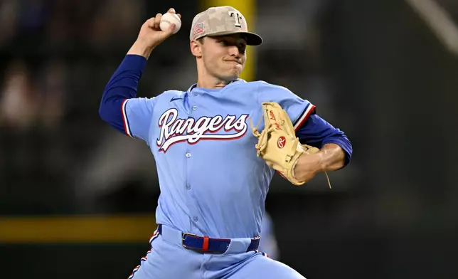 Texas Rangers starting pitcher Jack Leiter throws during the first inning against the Houston Astros in a baseball game in Arlington, Texas, Sunday, May 18, 2025. (AP Photo/Jerome Miron)