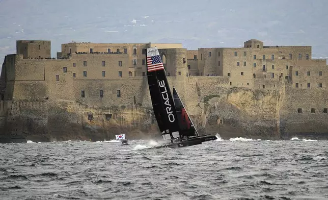 FILE -Oracle Racing Team of the U.S. sails past Castel dell'Ovo castle as it competes during the 34th America's Cup World Series Race day 1 regatta, in the Gulf of Naples, southern Italy, April 11, 2012. (AP Photo/Salvatore Laporta, File)