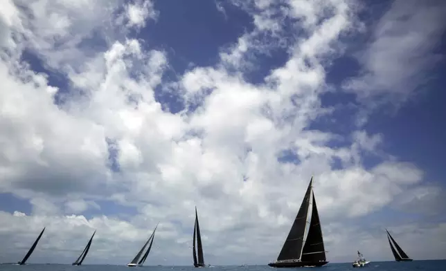 FILE - In this June 19, 2017, file photo, J Class boats race as part of America's Cup sailing event, in waters off of Bermuda. (AP Photo/Gregory Bull, File)
