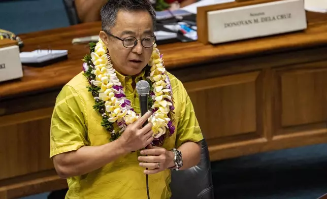 Hawaii Sen. Glenn Wakai speaks during the discussion of the bill that will increase the state's lodging tax, Friday, May 2, 2025, at the state Capitol in Honolulu. (AP Photo/Mengshin Lin)