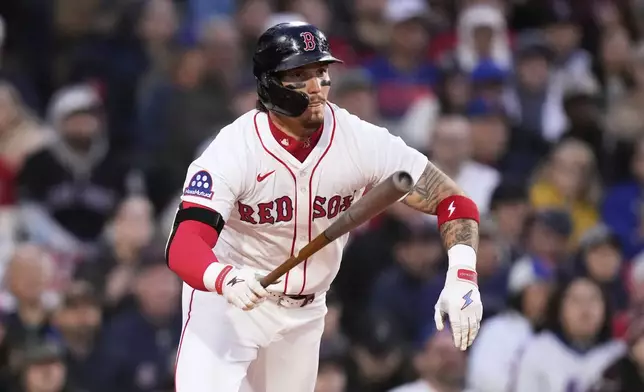 Boston Red Sox outfielder Jarren Duran watches the flight of his drive during the fourth inning of a baseball game against the New York Mets at Fenway Park, Monday, May 19, 2025, in Boston. (AP Photo/Charles Krupa)