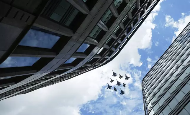 Russian Sukhoi Su-30SM jet fighters of The Russian Knights aerobatic team and Mikoyan MiG-29 jet fighters of The Swifts aerobatic team fly towards the Red Square for the Victory Day military parade general rehearsal in Moscow, Russia, Wednesday, May 7, 2025. (AP Photo/Pavel Bednyakov)
