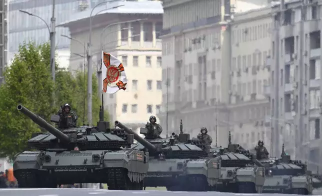 Russian battle tanks roll along the Garden Ring after the Victory Day military parade general rehearsal in Moscow, Russia, Wednesday, May 7, 2025. (AP Photo/Dmitry Serebryakov)