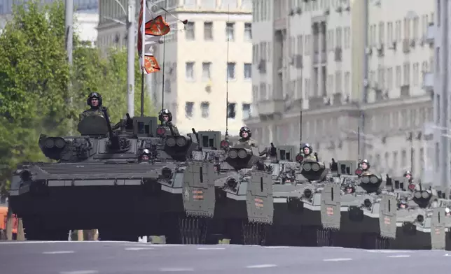 Russian BMP-2 infantry fighting vehicles roll along the Garden Ring after the Victory Day military parade general rehearsal in Moscow, Russia, Wednesday, May 7, 2025. (AP Photo/Dmitry Serebryakov)