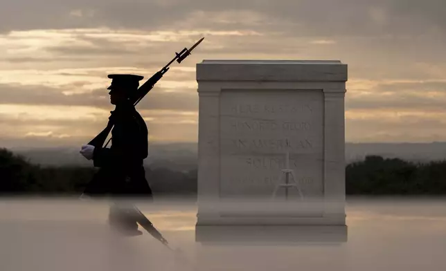 A tomb guard of the 3rd U.S. Infantry Regiment, known as "The Old Guard," patrols at the Tomb of the Unknown Soldier, Thursday, May 15, 2025, Arlington National Cemetery in Arlington, Va. (AP Photo/Julia Demaree Nikhinson)