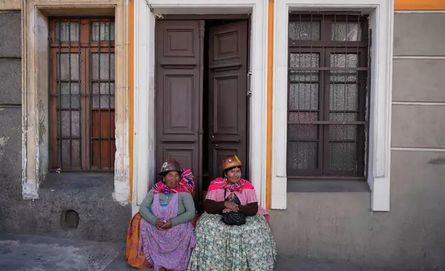 Independent miners rest after marching to demand a solution to the diesel shortage and the economic crisis, in La Paz, Bolivia, Thursday, May 15, 2025. (AP Photo/Juan Karita)