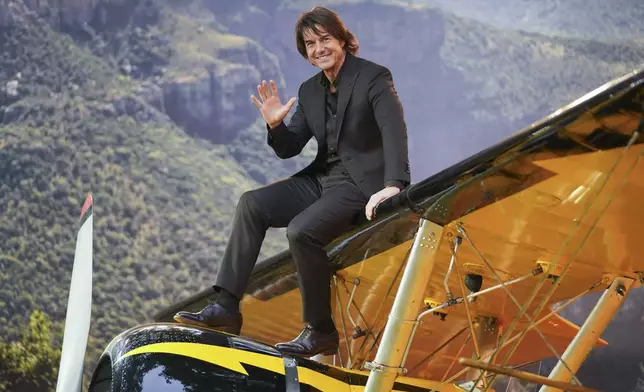 Tom Cruise poses for photographers upon arrival at the premiere of the film 'Mission: Impossible - The Final Reckoning' on Thursday, May 15, 2025, in London. (Photo by Alberto Pezzali/Invision/AP)