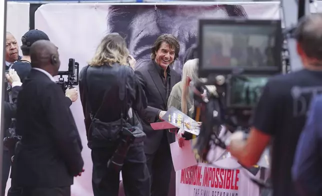 Tom Cruise poses for photographers upon arrival at the premiere of the film 'Mission: Impossible - The Final Reckoning' on Thursday, May 15, 2025, in London. (Photo by Alberto Pezzali/Invision/AP)
