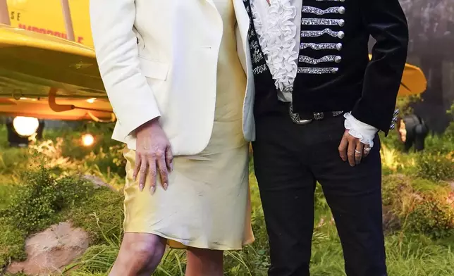 Penny Lancaster, left, and Rod Stewart pose for photographers upon arrival at the premiere of the film 'Mission: Impossible - The Final Reckoning' on Thursday, May 15, 2025, in London. (Photo by Alberto Pezzali/Invision/AP)