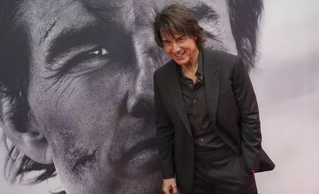 Tom Cruise poses for photographers upon arrival at the premiere of the film 'Mission: Impossible - The Final Reckoning' on Thursday, May 15, 2025, in London. (Photo by Alberto Pezzali/Invision/AP)