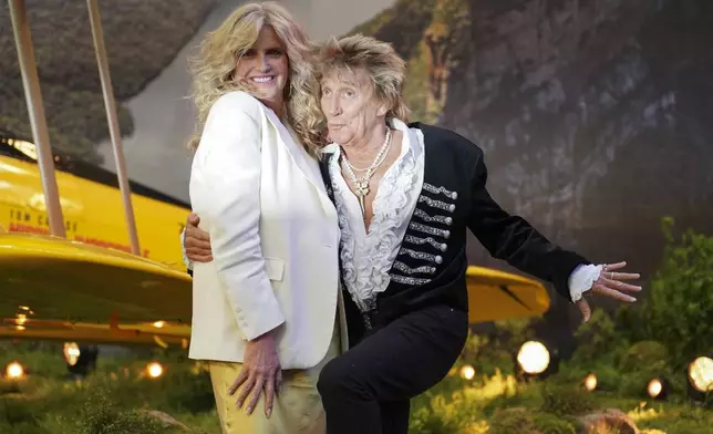 Penny Lancaster, left, and Rod Stewart pose for photographers upon arrival at the premiere of the film 'Mission: Impossible - The Final Reckoning' on Thursday, May 15, 2025, in London. (Photo by Alberto Pezzali/Invision/AP)
