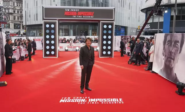 Tom Cruise poses for photographers upon arrival at the premiere of the film 'Mission: Impossible - The Final Reckoning' on Thursday, May 15, 2025, in London. (Photo by Alberto Pezzali/Invision/AP)