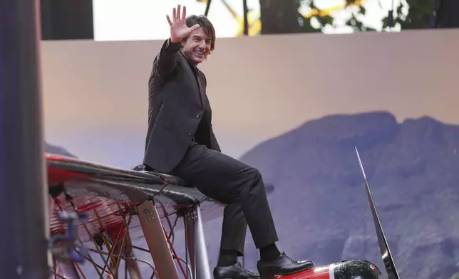 Tom Cruise poses for photographers upon arrival at the premiere of the film 'Mission: Impossible - The Final Reckoning' on Thursday, May 15, 2025, in London. (Photo by Alberto Pezzali/Invision/AP)