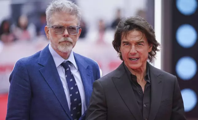 Director Christopher McQuarrie, left, and Tom Cruise pose for photographers upon arrival at the premiere of the film 'Mission: Impossible - The Final Reckoning' on Thursday, May 15, 2025, in London. (Photo by Alberto Pezzali/Invision/AP)