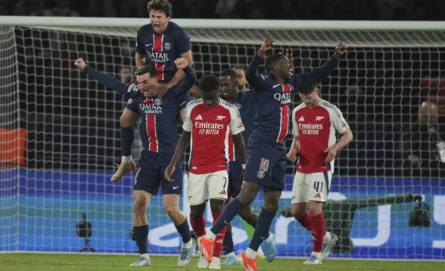 PSG players celebrate after the Champions League semifinal, second leg soccer match between Paris Saint-Germain and Arsenal at the Parc des Princes in Paris, Wednesday, May 7, 2025. (AP Photo/Thibault Camus)