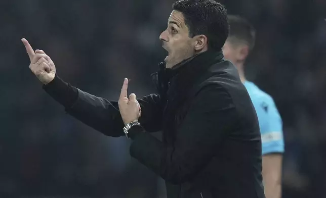 Arsenal's manager Mikel Arteta gestures during the Champions League semifinal, second leg soccer match between Paris Saint-Germain and Arsenal at the Parc des Princes in Paris, Wednesday, May 7, 2025. (AP Photo/Thibault Camus)