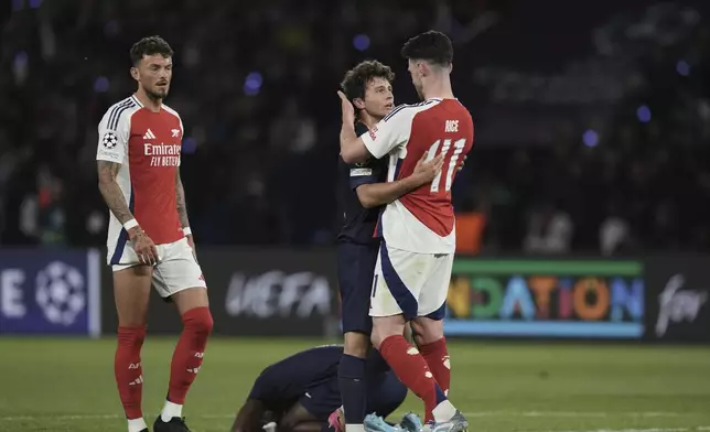 Players react after the Champions League semifinal, second leg soccer match between Paris Saint-Germain and Arsenal at the Parc des Princes in Paris, Wednesday, May 7, 2025. (AP Photo/Aurelien Morissard)
