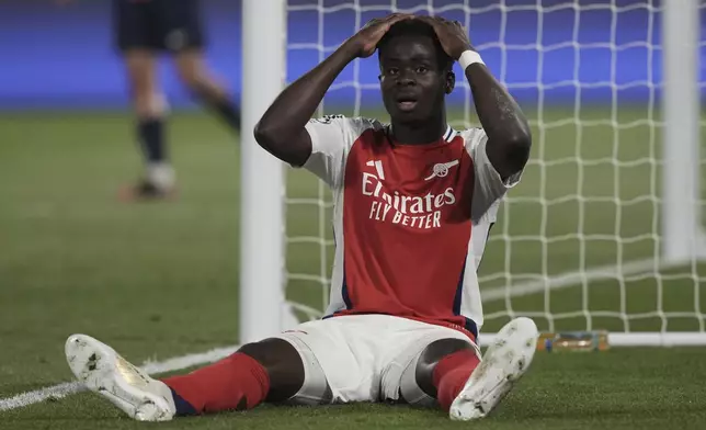 Arsenal's Bukayo Saka reacts during the Champions League semifinal, second leg soccer match between Paris Saint-Germain and Arsenal at the Parc des Princes in Paris, Wednesday, May 7, 2025. (AP Photo/Aurelien Morissard)