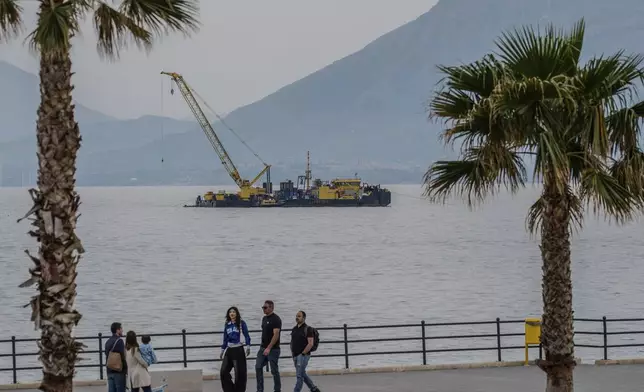 The multi-purpose floating work barge Hebo Lift 2 monitors the stretch of sea off Porticello, near Palermo, Sicily, Italy, Sunday, May 4, 2025, where the British superyacht Bayesian sunk on August 19, 2024 as the operations for its recovery start. (AP Photo/Salvatore Cavalli)