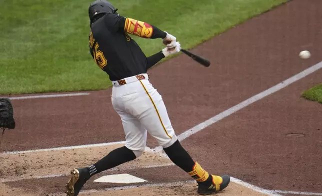 Pittsburgh Pirates' Oneil Cruz singles off San Diego Padres pitcher Randy Vásquez, driving in a run, during the second inning of a baseball game in Pittsburgh, Saturday, May 3, 2025. (AP Photo/Gene J. Puskar)