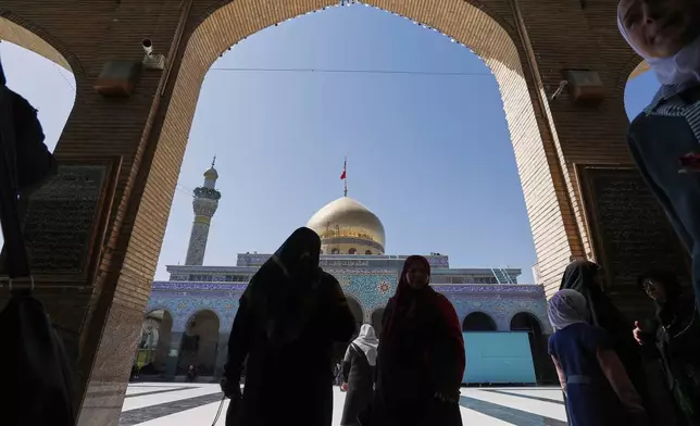 Shiite worshipers arrive at the Sayyida Zeinab Shrine, where they believe Zeinab, the granddaughter of Prophet Muhammad, is entombed, in Sayyida Zeinab, south of Damascus, Syria, Saturday, March 15, 2025. (AP Photo/Omar Sanadiki)