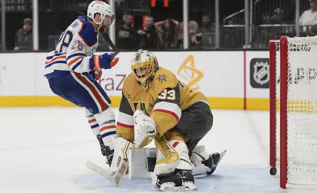 Edmonton Oilers right wing Connor Brown (28) scores against Vegas Golden Knights goaltender Adin Hill (33) during the third period of Game 1 of a second-round NHL hockey playoff series Tuesday, May 6, 2025, in Las Vegas. (AP Photo/John Locher)