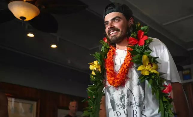 Oliver Widger, 29-year-old Oregon man who sailed from Oregon to Hawai, arrives at the Waikiki Yacht Club, on Saturday, May 24, 2025 in Waikiki, Hawaii. (AP Photo/Michelle Bir)