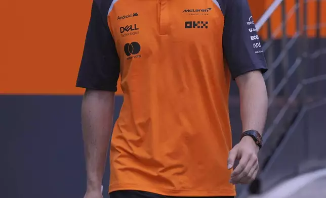 McLaren driver Oscar Piastri of Australia walks in the paddock at the Dino and Enzo Ferrari racetrack, ahead the Italy's Emilia Romagna Formula One Grand Prix in Imola, Italy, Thursday, May 15, 2025. (AP Photo/Antonio Calanni)