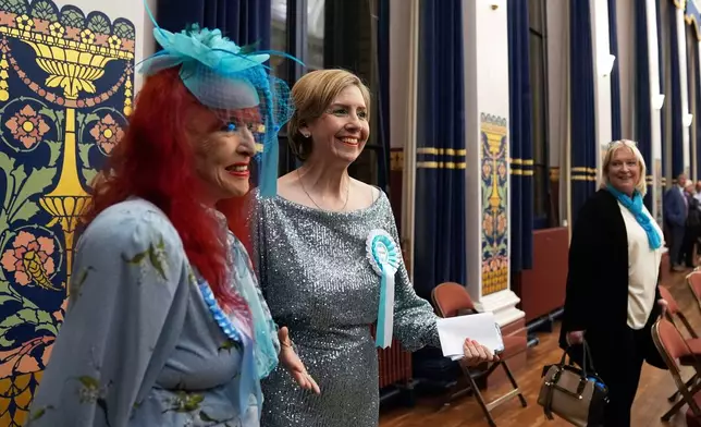 Reform U.K.'s Greater Lincolnshire mayoral candidate Dame Andrea Jenkyns, center, gestures during the count at Grimsby Town Hall, in Lincolnshire, England, for the Greater Lincolnshire Mayor election, Friday, May 2, 2025. (Joe Giddens/PA via AP)
